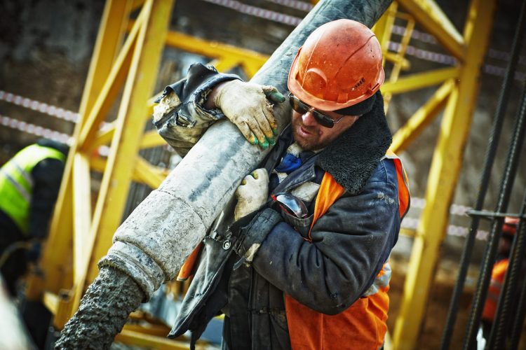 Canva - Man Carrying Gray Pipe